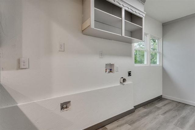 laundry room with laundry area, hookup for a washing machine, light wood-style floors, and electric dryer hookup