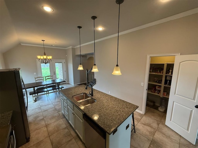 kitchen with ornamental molding, light tile patterned flooring, a center island with sink, a sink, and appliances with stainless steel finishes