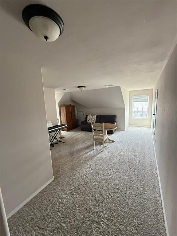 interior space featuring carpet floors and baseboards