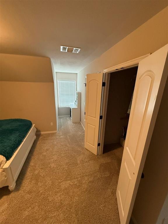 bedroom with carpet floors, baseboards, and visible vents