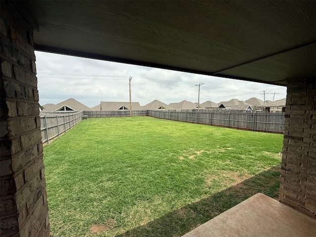 view of yard with a fenced backyard