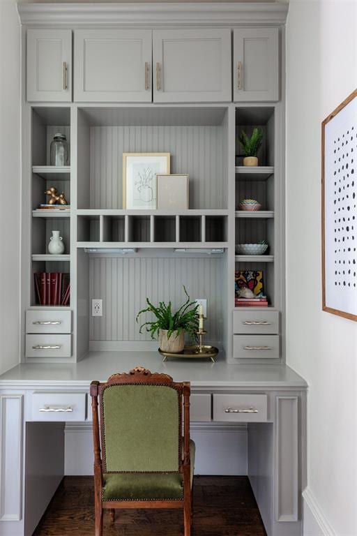 home office with built in study area and built in shelves