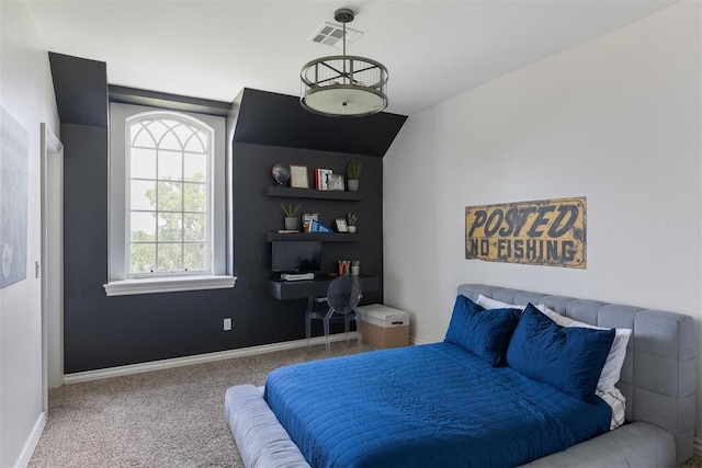 carpeted bedroom featuring baseboards