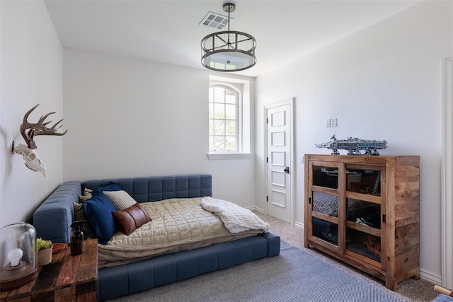 bedroom featuring carpet floors and baseboards
