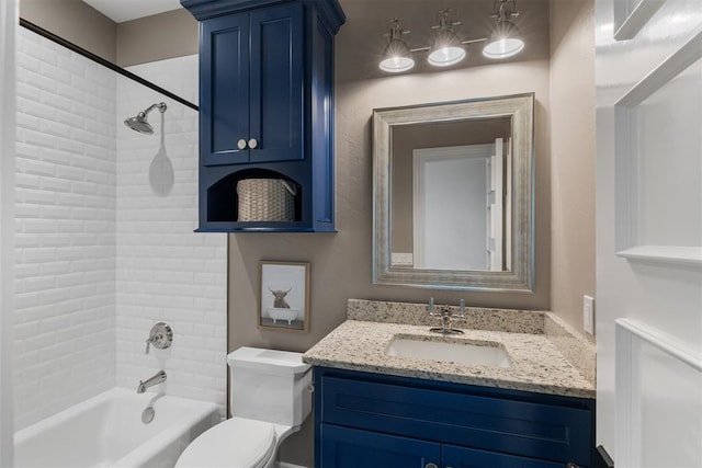 bathroom featuring toilet, vanity, and shower / bathtub combination