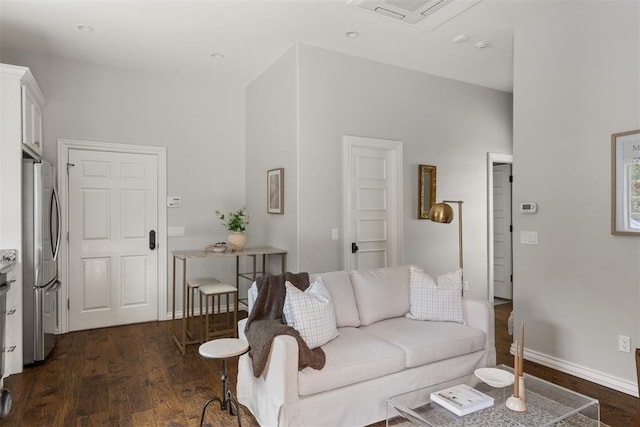 living area featuring dark wood-style floors and baseboards