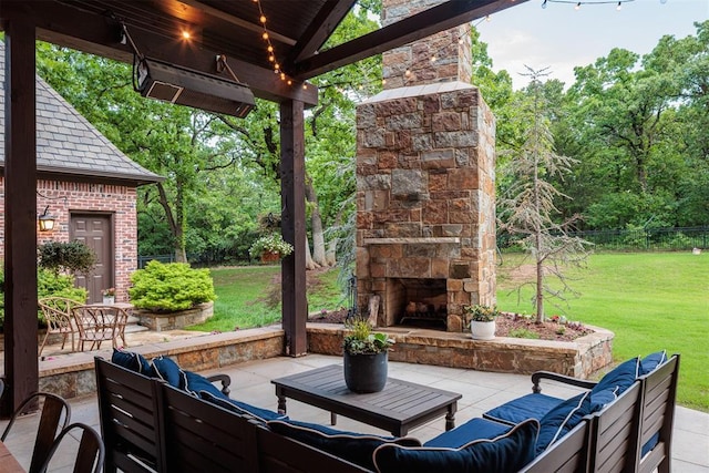 view of patio / terrace with an outdoor living space with a fireplace