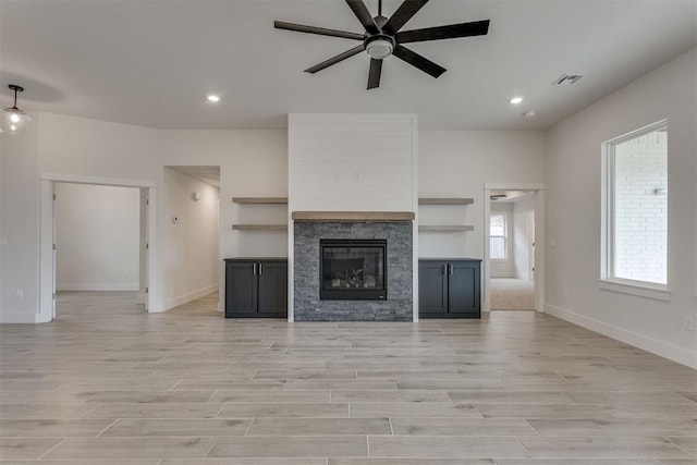 unfurnished living room with baseboards, recessed lighting, light wood finished floors, and ceiling fan