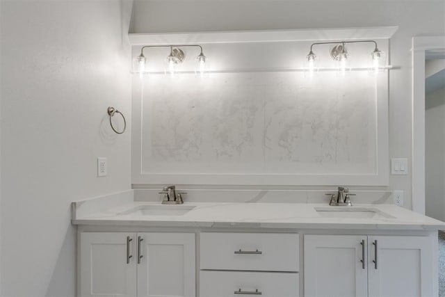 bathroom featuring double vanity and a sink