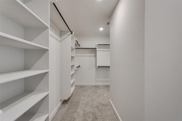 spacious closet with visible vents and carpet