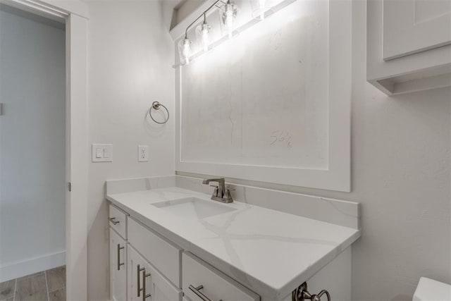bathroom featuring wood finished floors and vanity