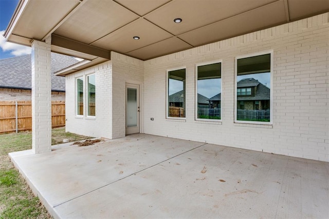 view of patio featuring fence