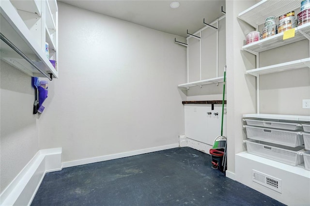walk in closet with visible vents