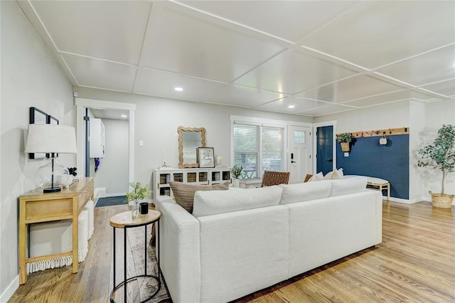 living area featuring recessed lighting, baseboards, wood finished floors, and coffered ceiling