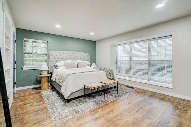 bedroom featuring recessed lighting, baseboards, and wood finished floors