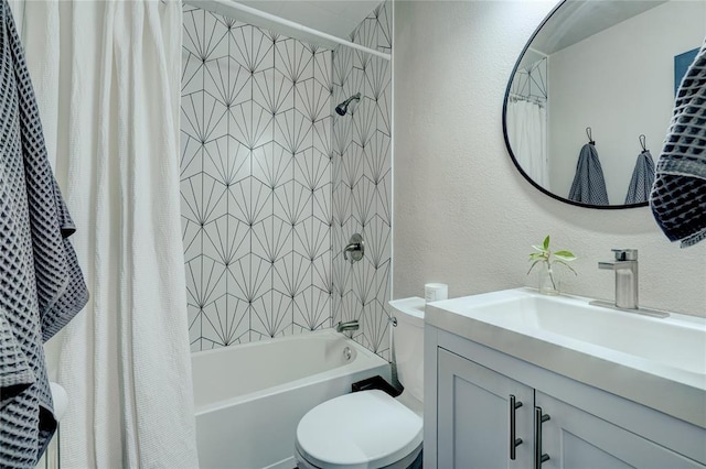 full bath featuring vanity, a textured wall, toilet, and shower / tub combo with curtain