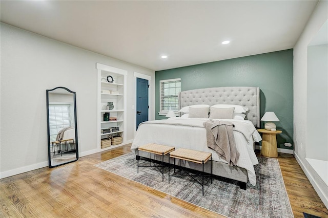 46 E 14th St, Edmond, OK 73034 - bedroom with baseboards, wood finished floors, and recessed lighting