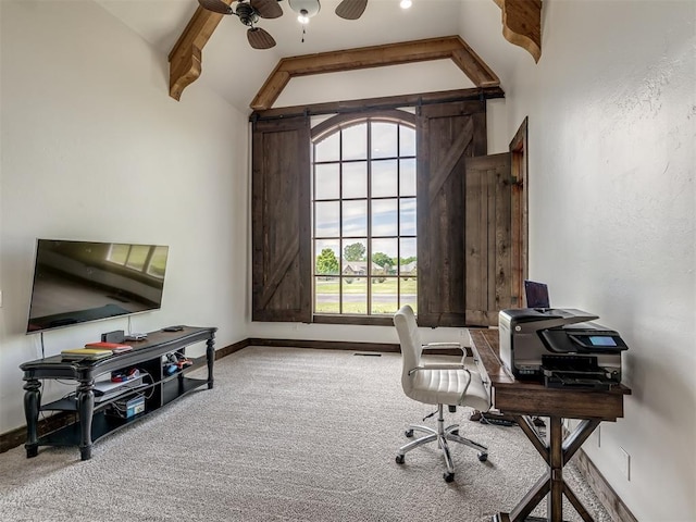 carpeted office featuring vaulted ceiling with beams, a ceiling fan, and baseboards