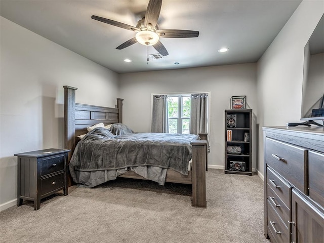 bedroom with a ceiling fan, visible vents, light colored carpet, baseboards, and recessed lighting