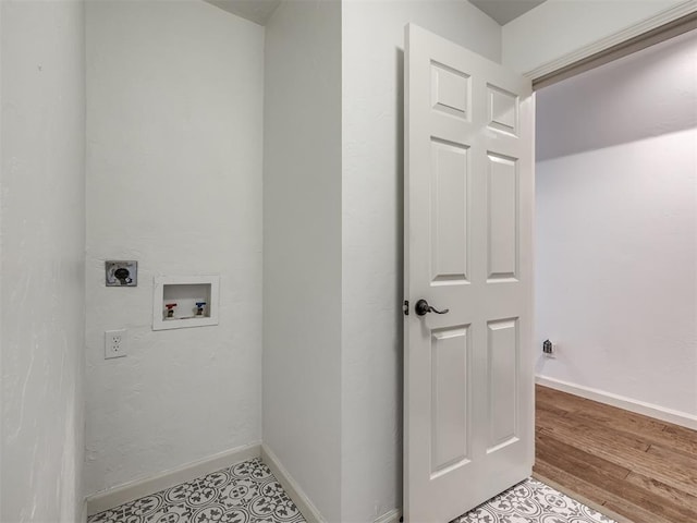 clothes washing area featuring laundry area, hookup for a washing machine, baseboards, and hookup for an electric dryer
