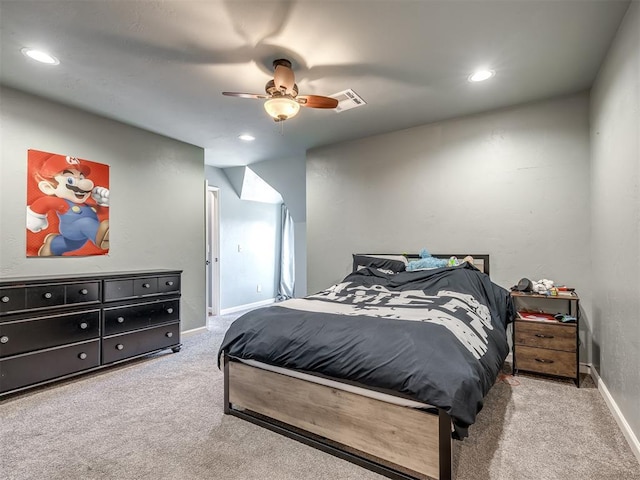 carpeted bedroom featuring recessed lighting, ceiling fan, and visible vents