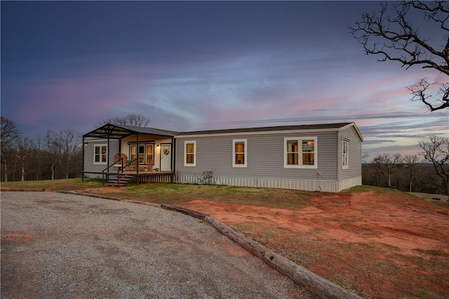 25386 Patterson Rd, Tecumseh, OK 74873 - manufactured / mobile home featuring covered porch and driveway