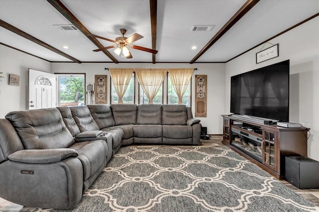 25386 Patterson Rd, Tecumseh, OK 74873 - living area featuring ceiling fan, beam ceiling, wood finished floors, plenty of natural light, and recessed lighting