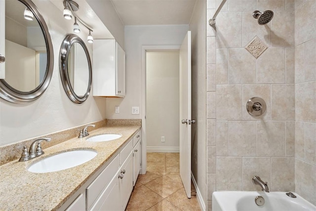 full bath featuring a sink, tile patterned floors, double vanity, and bathing tub / shower combination