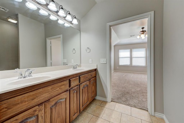 full bathroom featuring baseboards, tile patterned flooring, ceiling fan, and double vanity