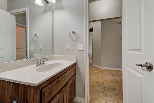 bathroom featuring vanity and baseboards
