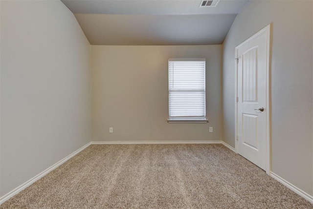 unfurnished bedroom with lofted ceiling, carpet flooring, and baseboards