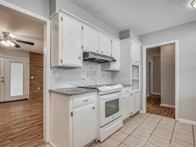 kitchen with ceiling fan, a textured ceiling, white cabinetry, under cabinet range hood, and white electric stove