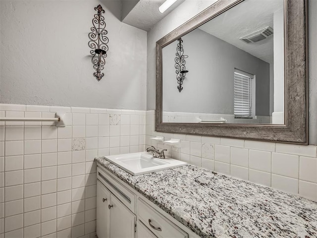 bathroom featuring visible vents and vanity