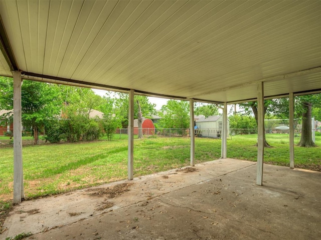 view of patio featuring a storage shed, an outdoor structure, and a fenced backyard