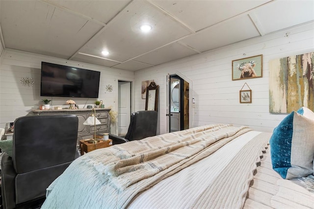 bedroom with wooden walls