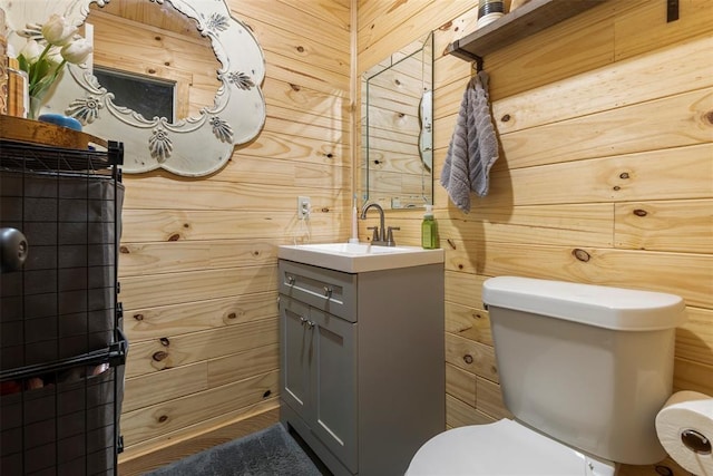 half bathroom with toilet and vanity