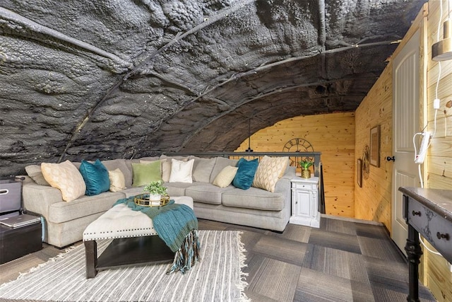 carpeted living room with vaulted ceiling