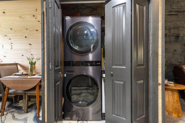 laundry room with laundry area and stacked washer / dryer