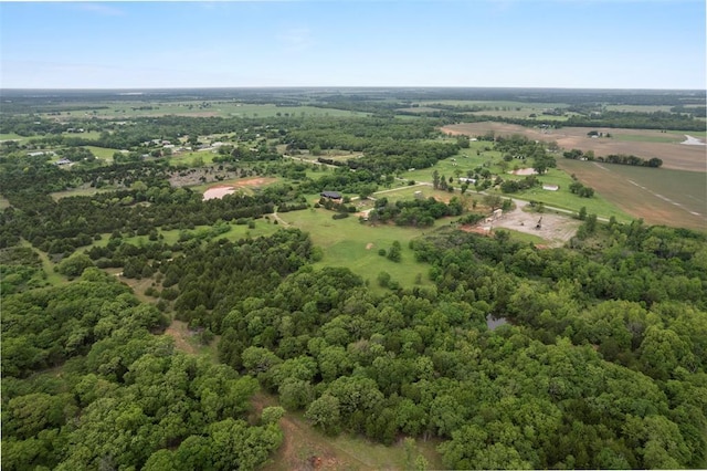 aerial view featuring a rural view and a wooded view
