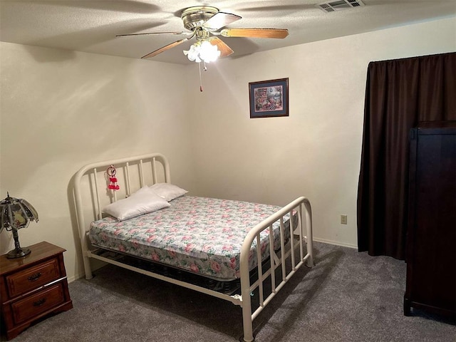carpeted bedroom with ceiling fan and visible vents