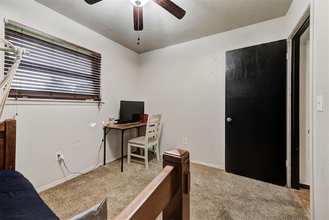 carpeted bedroom featuring baseboards and ceiling fan