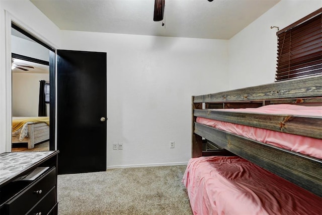 bedroom with baseboards, carpet flooring, and ceiling fan
