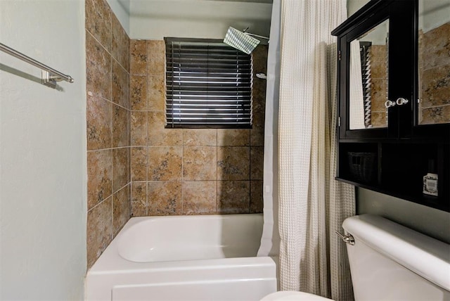 bathroom with shower / bath combo and toilet