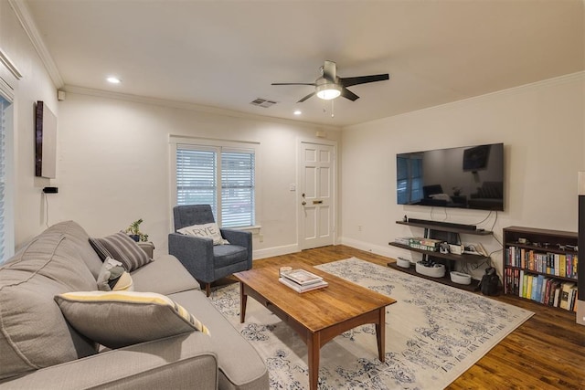 living room featuring recessed lighting, ceiling fan, ornamental molding, and wood finished floors