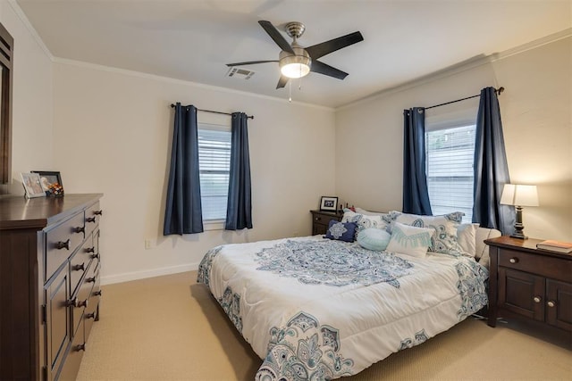 bedroom with crown molding, baseboards, multiple windows, and light carpet