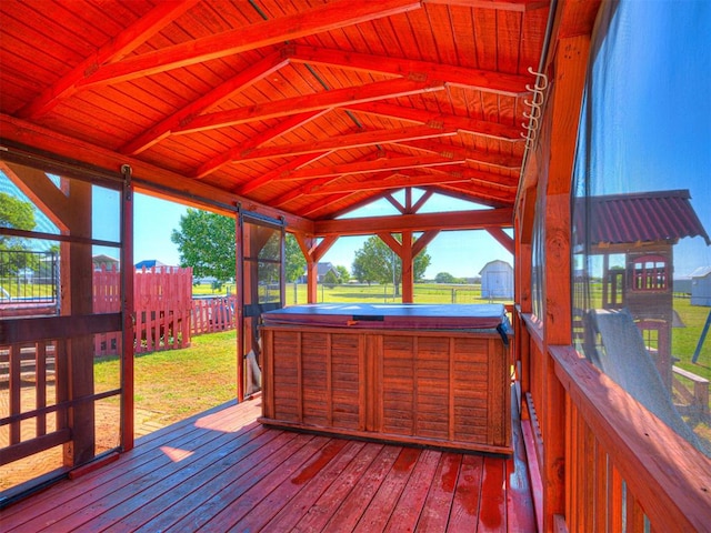 910860 S 3350th Rd, Wellston, OK 74881 - wooden terrace featuring a yard, an outbuilding, a hot tub, a storage shed, and a fenced backyard