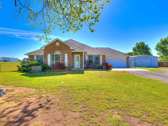 910860 S 3350th Rd, Wellston, OK 74881 - view of front of house with driveway, brick siding, a front lawn, and fence