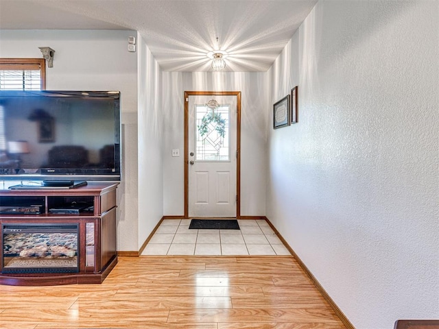 910860 S 3350th Rd, Wellston, OK 74881 - foyer entrance featuring light wood-style flooring, a wealth of natural light, baseboards, and a textured wall