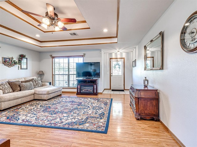 910860 S 3350th Rd, Wellston, OK 74881 - living area with baseboards, ceiling fan, visible vents, wood finished floors, and a raised ceiling