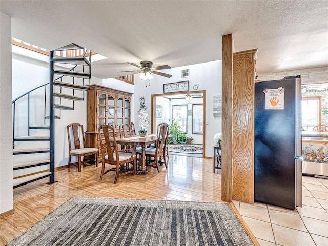 910860 S 3350th Rd, Wellston, OK 74881 - dining room featuring ceiling fan, stairway, visible vents, and wood finished floors